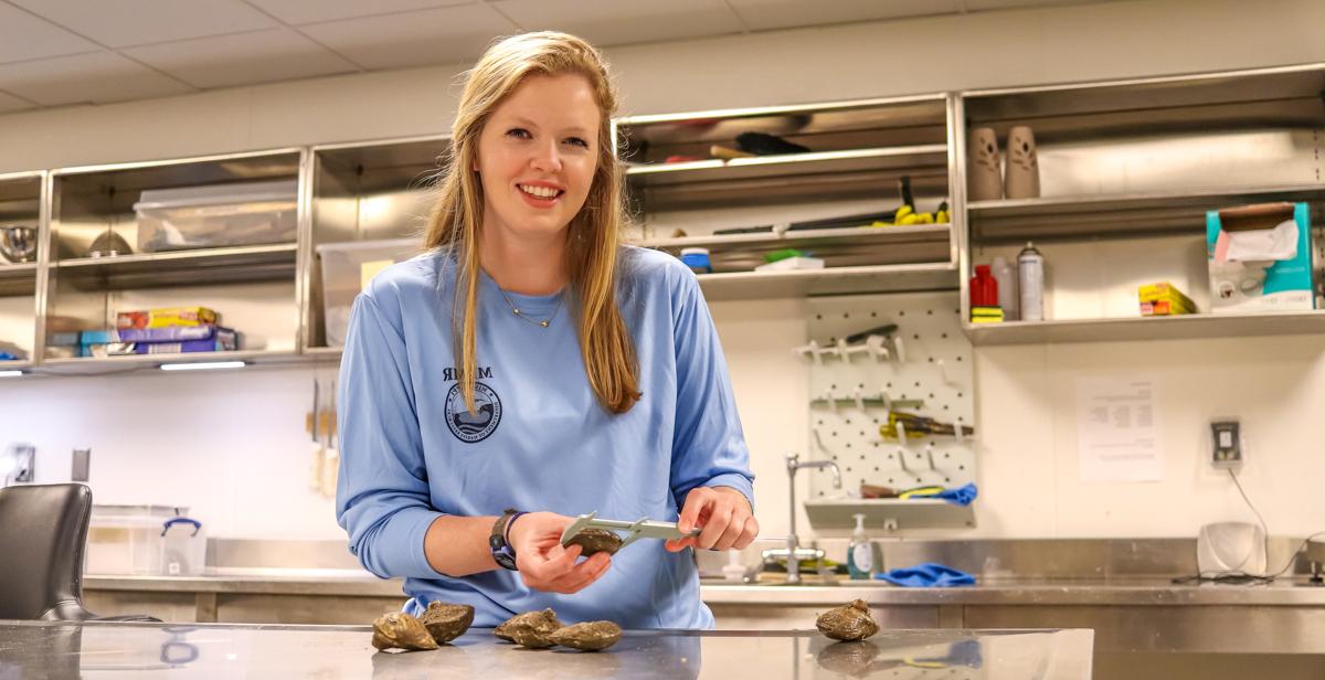 Merritt McCall's duties with the Mississippi Department of Marine Resources include building, seeding and monitoring oyster beds in state waters. she recently earned her master's degree in marine science from the University of South Alabama.